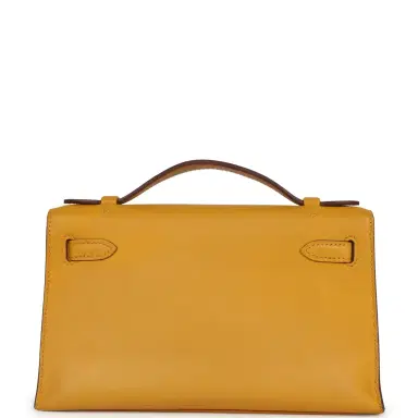 HERMÈS Pre-owned Hermes Kelly Pochette Jaune Ambre Swift Palladium Hardware | Thumbnail 5 HERMÈS Pre-owned Hermes Kelly Pochette Jaune Ambre Swift Palladium Hardware | Thumbnail 5