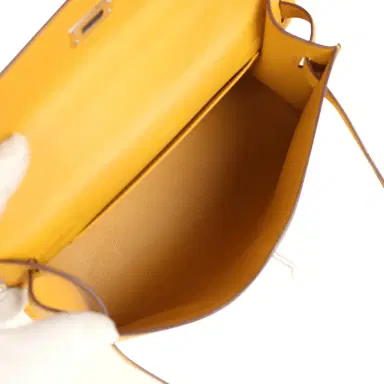HERMÈS Pre-owned Hermes Kelly Pochette Jaune Ambre Swift Palladium Hardware | Thumbnail 8 HERMÈS Pre-owned Hermes Kelly Pochette Jaune Ambre Swift Palladium Hardware | Thumbnail 8